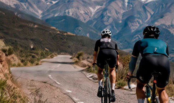 Road cyclists climbing a mountain route in southern Spain