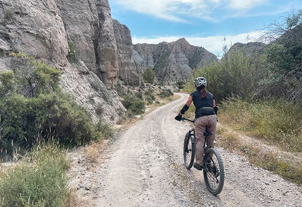 Female cyclist riding through the Gorafe Desert in the Granada Geopark